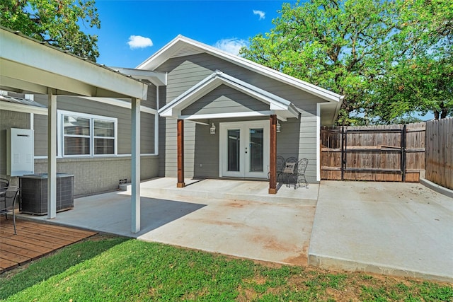 411 Harcourt St, Weatherford, TX 76086 - rear view of property featuring french doors, a patio, a deck, and brick siding