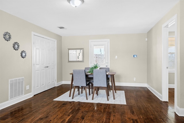 411 Harcourt St, Weatherford, TX 76086 - dining space featuring dark wood finished floors and baseboards