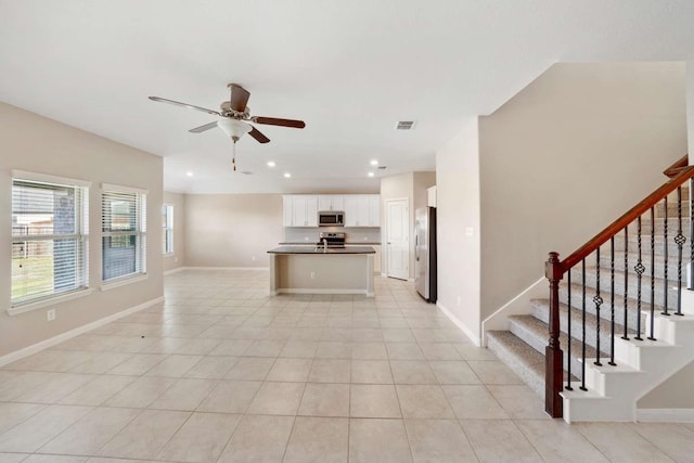 120 Big Bend Dr, Forney, TX 75126 - kitchen with stainless steel appliances, open floor plan, dark countertops, a ceiling fan, and recessed lighting