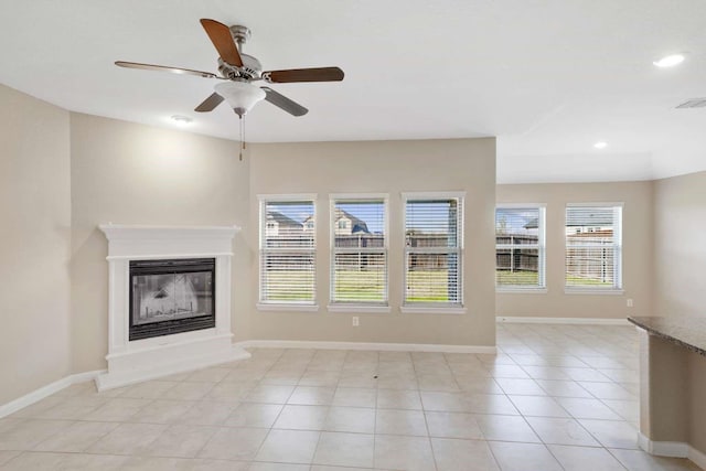 120 Big Bend Dr, Forney, TX 75126 - unfurnished living room with ceiling fan, a glass covered fireplace, light tile patterned floors, and recessed lighting