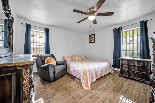 6354 Cinnamon Oaks, Dallas, TX 75241 - bedroom with a ceiling fan and a textured ceiling