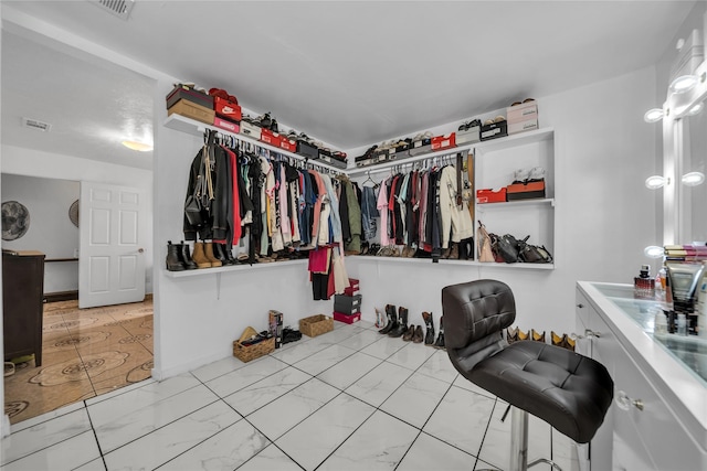 6354 Cinnamon Oaks, Dallas, TX 75241 - walk in closet with marble look tile flooring