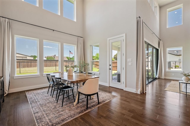 233 Kirkpatrick Ct, Argyle, TX 76226 - dining area featuring a towering ceiling and dark wood-style floors