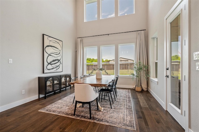 233 Kirkpatrick Ct, Argyle, TX 76226 - dining space featuring a high ceiling and dark wood-type flooring