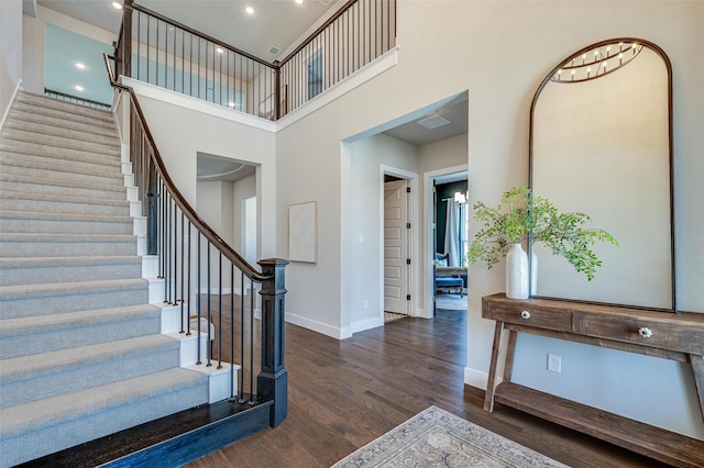 233 Kirkpatrick Ct, Argyle, TX 76226 - stairway featuring wood finished floors, a high ceiling, and recessed lighting