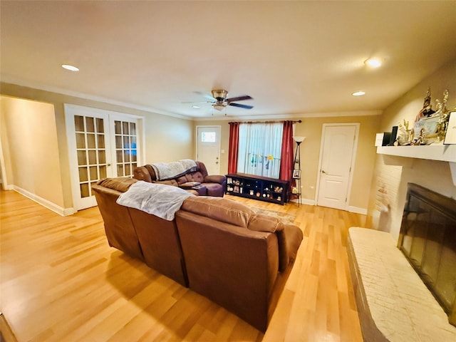 380 NE 32nd St, Paris, TX 75460 - living room with a fireplace, light wood-style floors, crown molding, a ceiling fan, and recessed lighting