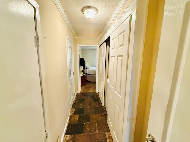 380 NE 32nd St, Paris, TX 75460 - hall featuring ornamental molding, a textured ceiling, and dark stone finish floors