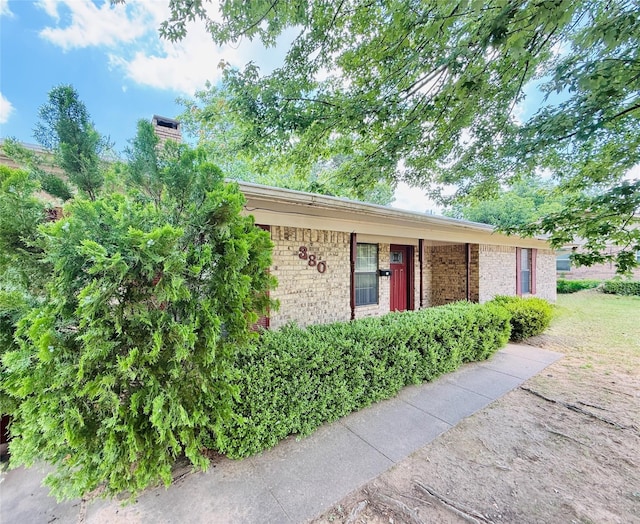 380 NE 32nd St, Paris, TX 75460 - view of front of house with brick siding and a chimney