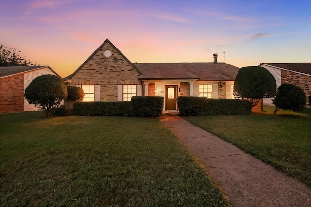 1708 Hutchinson St, Mesquite, TX 75150 - view of front of property with a lawn and stone siding