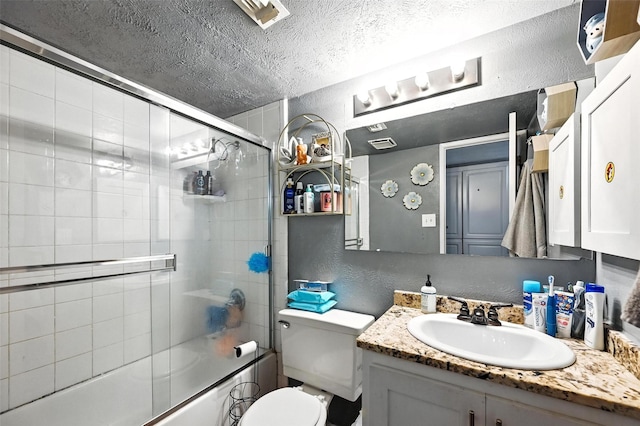 1708 Hutchinson St, Mesquite, TX 75150 - bathroom featuring a textured wall, a textured ceiling, vanity, and bath / shower combo with glass door