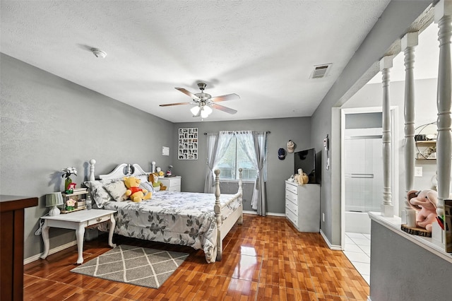 1708 Hutchinson St, Mesquite, TX 75150 - bedroom with a textured ceiling, wood finished floors, a ceiling fan, and connected bathroom