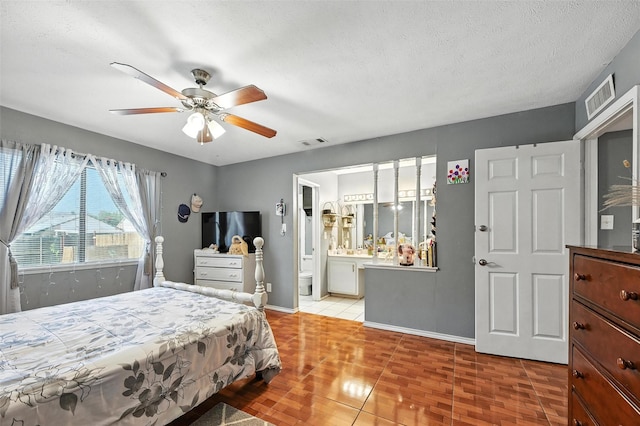 1708 Hutchinson St, Mesquite, TX 75150 - bedroom with a textured ceiling, ceiling fan, and connected bathroom