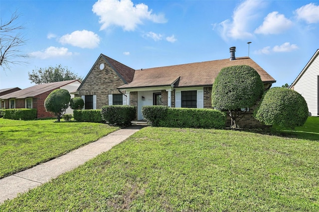 1708 Hutchinson St, Mesquite, TX 75150 - view of front facade with brick siding and a front yard