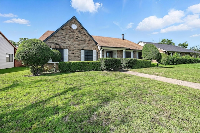 1708 Hutchinson St, Mesquite, TX 75150 - view of front of house with brick siding and a front yard