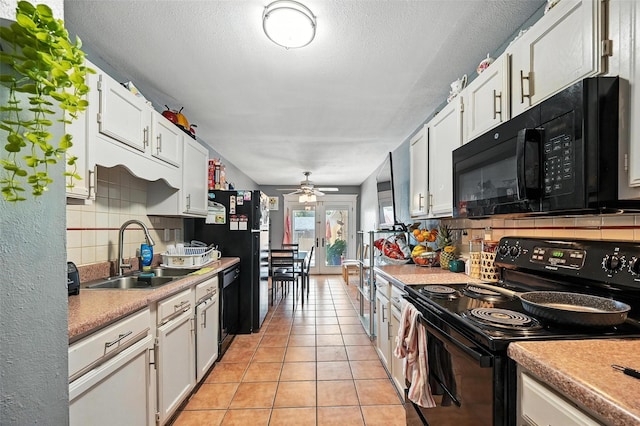 1708 Hutchinson St, Mesquite, TX 75150 - kitchen featuring black appliances, decorative backsplash, white cabinets, ceiling fan, and light countertops