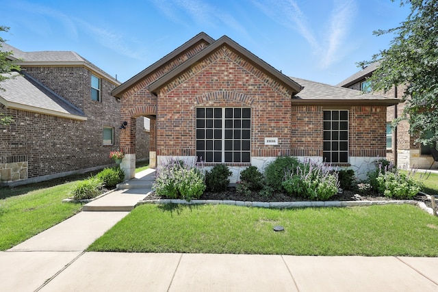 2136 Miramar Dr, Little Elm, TX 75068 - view of front of house featuring brick siding and a front lawn