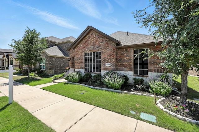 2136 Miramar Dr, Little Elm, TX 75068 - view of front of property with brick siding, roof with shingles, and a front lawn