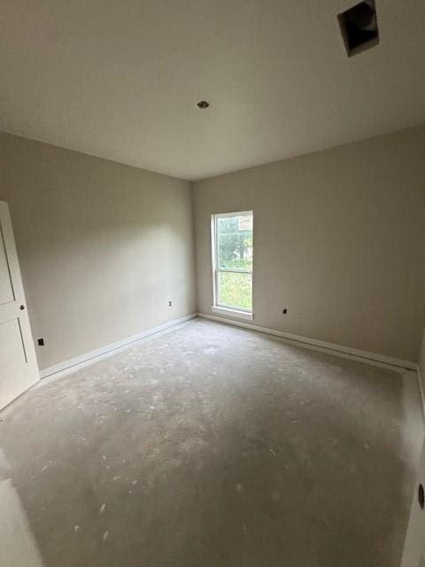 1011 Holden St Unit 1, Glen Rose, TX 76043 - spare room with concrete flooring and baseboards
