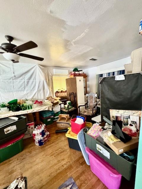 2025 16th St, Garland, TX 75041 - storage featuring a wall unit AC and ceiling fan