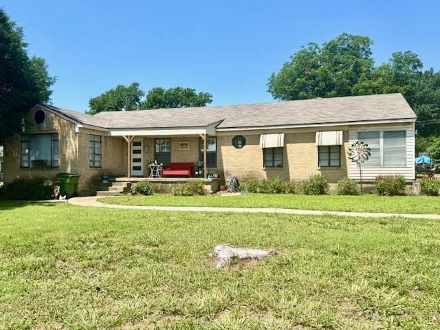 2025 16th St, Garland, TX 75041 - ranch-style home featuring a porch and a front yard