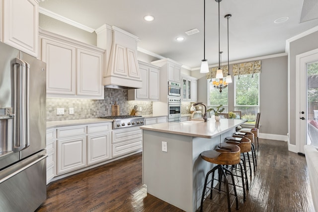 2824 Mastil Rd, Grand Prairie, TX 75054 - kitchen with stainless steel appliances, ornamental molding, light countertops, white cabinets, and dark wood-style flooring