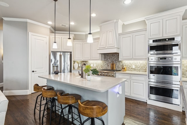 2824 Mastil Rd, Grand Prairie, TX 75054 - kitchen featuring appliances with stainless steel finishes, ornamental molding, tasteful backsplash, dark wood finished floors, and a kitchen bar