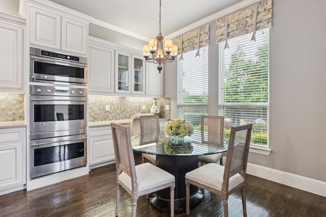 2824 Mastil Rd, Grand Prairie, TX 75054 - dining space featuring a chandelier, dark wood-style flooring, and ornamental molding