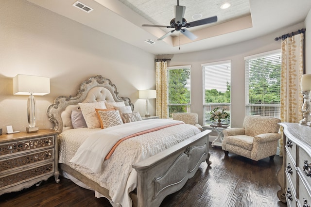 2824 Mastil Rd, Grand Prairie, TX 75054 - bedroom featuring a raised ceiling, dark wood-style floors, and ceiling fan