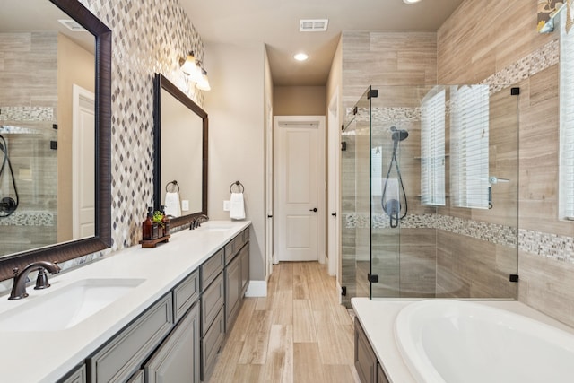 2824 Mastil Rd, Grand Prairie, TX 75054 - full bathroom featuring double vanity, a stall shower, a bath, and recessed lighting