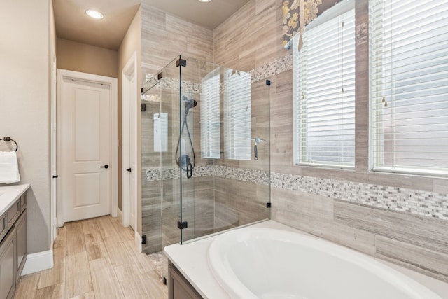 2824 Mastil Rd, Grand Prairie, TX 75054 - full bathroom featuring vanity, a garden tub, a shower stall, and recessed lighting