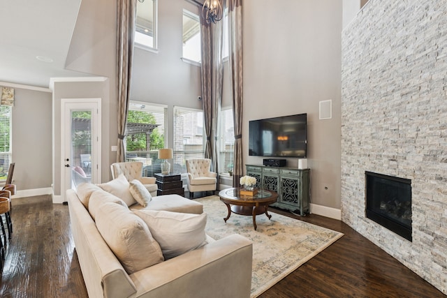 2824 Mastil Rd, Grand Prairie, TX 75054 - living room with a high ceiling, dark wood-style floors, and a stone fireplace