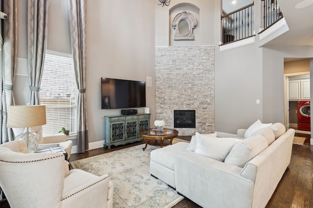 2824 Mastil Rd, Grand Prairie, TX 75054 - living room featuring a towering ceiling, healthy amount of natural light, wood finished floors, and washer / clothes dryer