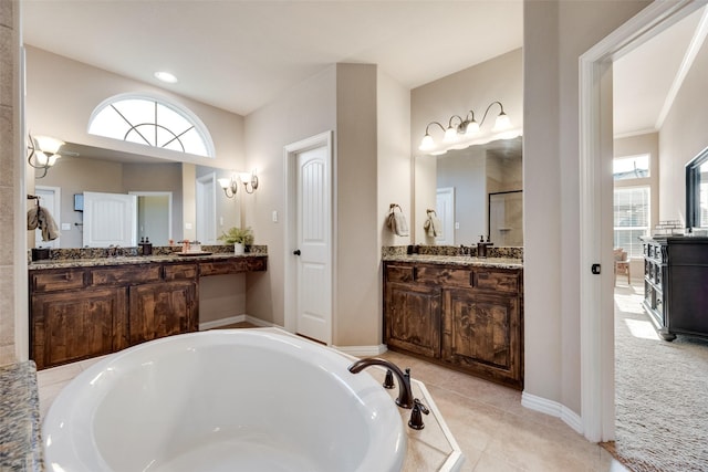 12517 Peace River Dr, Frisco, TX 75035 - bathroom featuring a garden tub, a stall shower, two vanities, and tile patterned floors