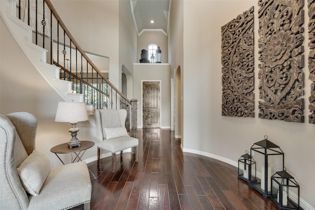 12517 Peace River Dr, Frisco, TX 75035 - foyer with arched walkways, hardwood / wood-style flooring, stairs, high vaulted ceiling, and ornamental molding