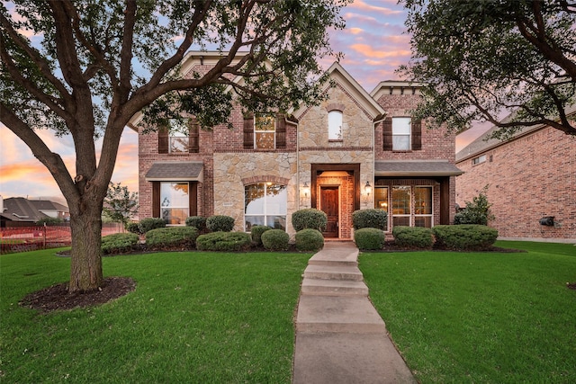 12517 Peace River Dr, Frisco, TX 75035 - view of front of property featuring a yard, brick siding, and stone siding