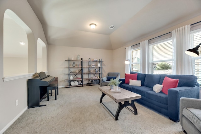 12517 Peace River Dr, Frisco, TX 75035 - living area with carpet flooring, arched walkways, and lofted ceiling