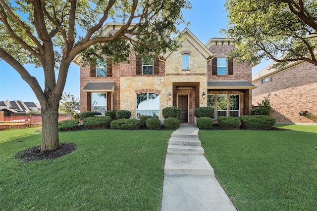12517 Peace River Dr, Frisco, TX 75035 - traditional-style house with a front lawn, brick siding, and stone siding