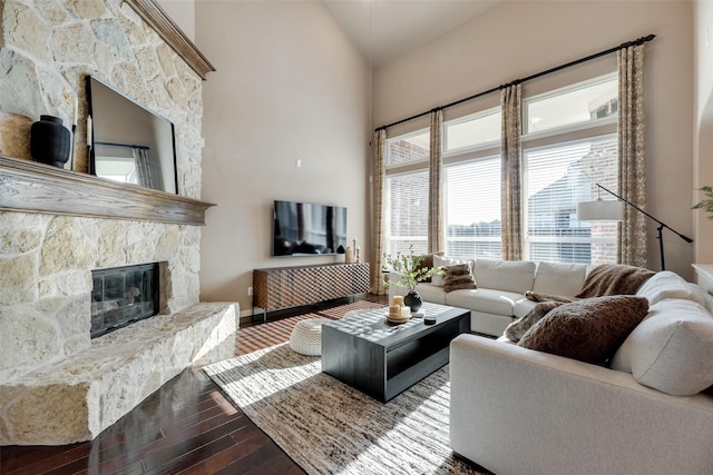 12517 Peace River Dr, Frisco, TX 75035 - living room with dark wood finished floors, a fireplace, and high vaulted ceiling