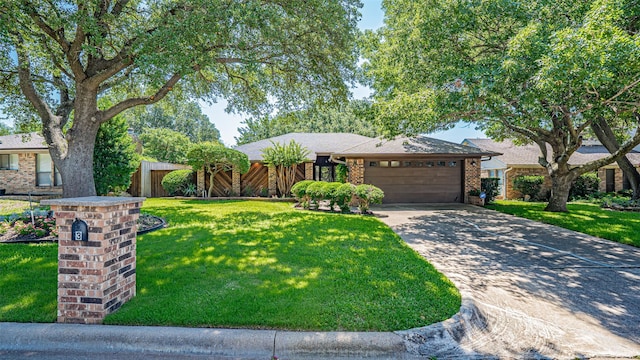 3 Cimarron Dr, Trophy Club, TX 76262 - view of front facade featuring an attached garage, a front lawn, brick siding, and driveway