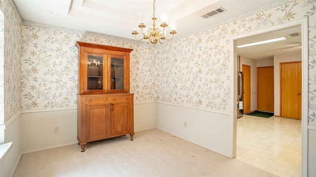 3 Cimarron Dr, Trophy Club, TX 76262 - unfurnished room featuring a chandelier, wallpapered walls, and wainscoting