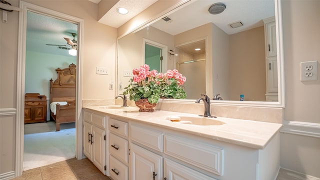 3 Cimarron Dr, Trophy Club, TX 76262 - full bath with double vanity, ceiling fan, a shower, and tile patterned floors