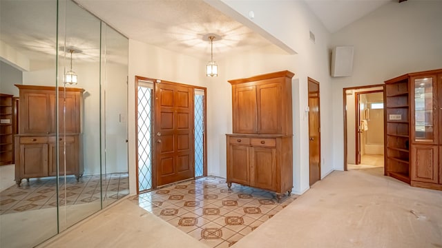 3 Cimarron Dr, Trophy Club, TX 76262 - entryway with light tile patterned floors and high vaulted ceiling