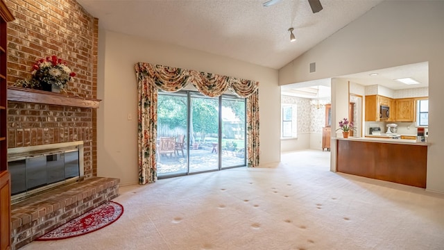 3 Cimarron Dr, Trophy Club, TX 76262 - living area featuring a brick fireplace, light carpet, ceiling fan, plenty of natural light, and lofted ceiling
