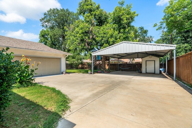2008 Morningside Dr, Garland, TX 75041 - view of parking / parking lot with a storage shed and a detached garage