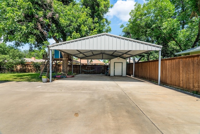 2008 Morningside Dr, Garland, TX 75041 - view of vehicle parking with a storage unit, a detached carport, and concrete driveway