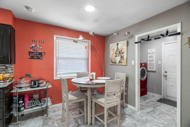2008 Morningside Dr, Garland, TX 75041 - dining space with washer / dryer and baseboards