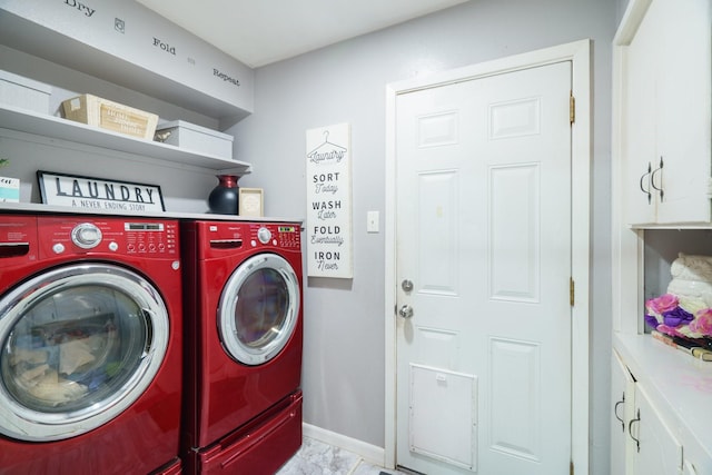 2008 Morningside Dr, Garland, TX 75041 - laundry area featuring washing machine and dryer, light marble finish flooring, and cabinet space