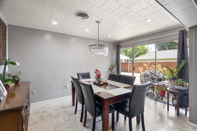 2008 Morningside Dr, Garland, TX 75041 - dining area featuring a chandelier and baseboards