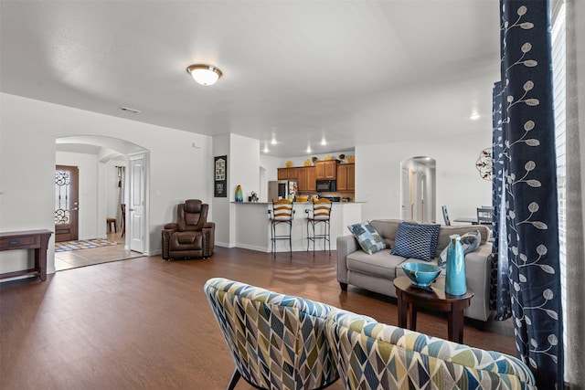 104 Knoll Ln, Decatur, TX 76234 - living area with arched walkways and wood finished floors