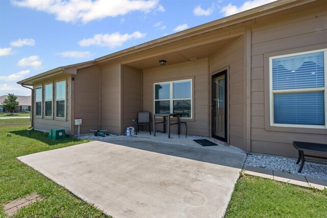 104 Knoll Ln, Decatur, TX 76234 - back of house featuring a patio area and a yard